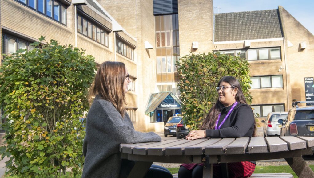 Employees talking outside Swindon office